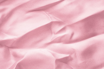 Wall Mural - Texture of a crumpled pink  fabric with large folds