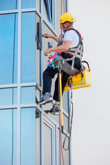 window washer working at building outdoor