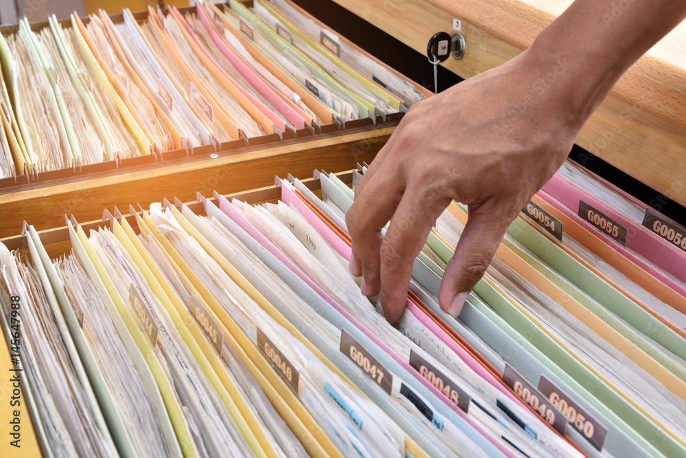 Financial documents stored in filing cabinets. Stock Photo | Adobe Stock