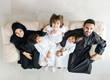 © Jasmin Merdan - High angle view portrait of happy Arabic Muslim family at new modern home