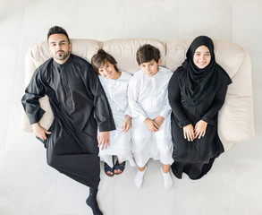 Wall Mural - High angle view portrait of happy Arabic Muslim family at new modern home