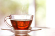 Close up warm black tea cup on  wooden table in living room , relax with tea time concept