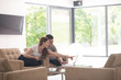 © .shock - couple relaxing at  home with tablet and laptop computers