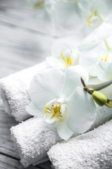 Wall Mural - White Orchid on wooden background with towel