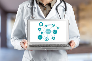 Hands of medical doctor woman with laptop