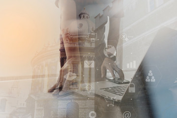 Wall Mural - businessman working with smart phone and laptop computer on wooden desk in modern office with London city exposure