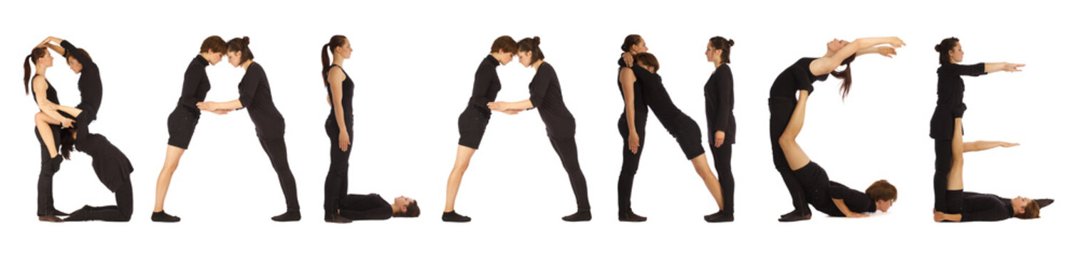 Black dressed people forming word BALANCE