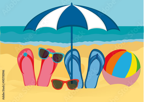Flip-flops and sunglasses with a beach umbrella on the sandy beach ...