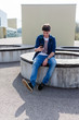 © Nena - Young man checking his smartphone