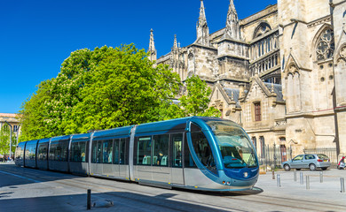 Canvas Print - City tram at the Cathedral of Bordeaux, France