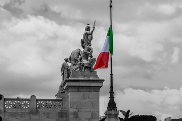 black and white view of altare della patria in Rome, Italy and a colored flag