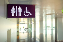 Toilets Icon. Public Restroom Signs With A Disabled Access Symbol. Interior Of Airport Terminal.