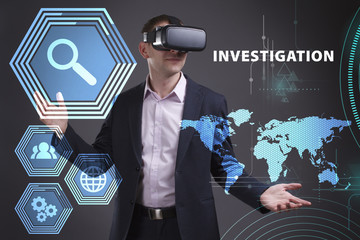 Business, Technology, Internet and network concept. Young businessman working on a virtual screen of the future and sees the inscription: Investigation