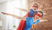 Girl And Mom In Superhero Costumes