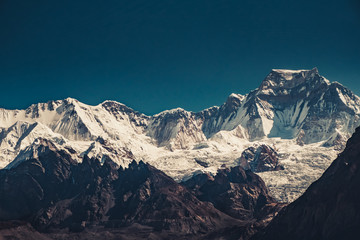 Wall Mural - Beautiful mountain range in sunrise light. Dramatic and majestic nature landscape. Trekking in Nepal to Everest Base Camp, Himalaya. Vintage toning effect. Exploring beauty world. Natural background