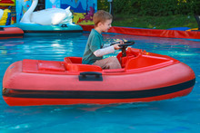 Child Riding On A Boat