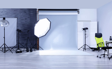 Canvas Print - Modern photo studio with professional lighting equipment