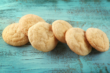 Tasty sugar cookies on wooden table