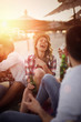 © NDABCREATIVITY - Friends partying and having fun on beach at summer