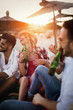 © NDABCREATIVITY - Happy group of young people having fun on beach