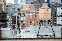Old Vintage Water Tanks On The Roof In New York City Manhattan Midtown.
