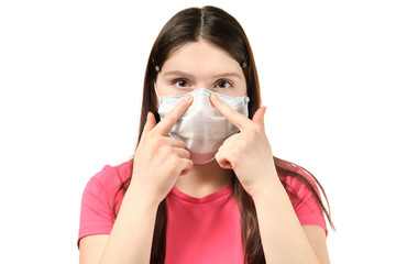 a young girl in a pink dress and is holding the nose clip medical mask