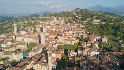 Drone aerial view of Bergamo - Old city. One of the beautiful city in Italy. Landscape on the city center, its historical buildings and towers during a wonderful blu day