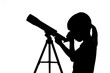 Leinwandbild Motiv Silhouette of little girl looking through a telescope