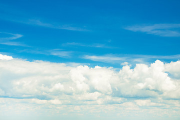 Poster - white fluffy clouds in the blue sky