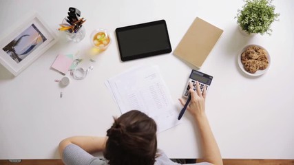 Sticker - woman with papers and calculator at home office