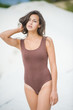 © alipko - Fitness beautiful slim girl with brown hair posing