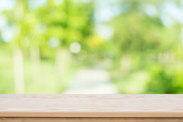 Wall Mural - Empty table top on blurred nature background,Space for placing products