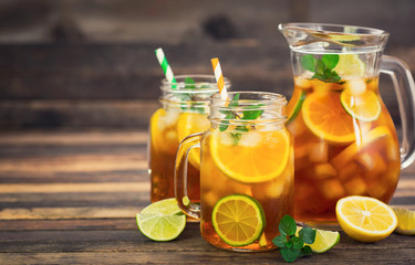 Ice tea with lemon, lime and mint 