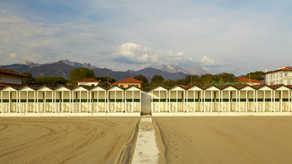 Wall Mural - sea cabins view on versilia beach on sunset