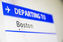 Computer Screen Close-up Of Status Of Flight Departing To Boston, Massachusetts, USA