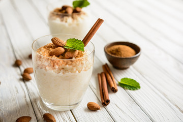 Wall Mural - Creamy rice pudding topped with cinnamon and almond