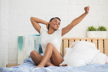 Happy African Woman Waking Up