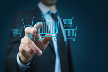 Wall Mural - Businessman pressing shopping basket icon