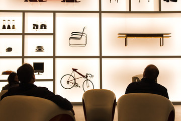 Munich, 5th February 2017.  People sitting down in front of an exhibit of designer items at Museum Brandhorst.