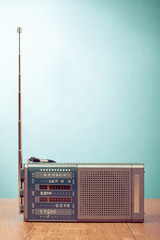 Wall Mural - Retro old radio front mint green background. Vintage style filtered photo