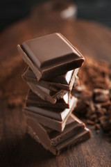 Sticker - Stack of chocolate pieces on table, closeup