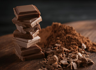 Sticker - Stack of chocolate pieces on table, closeup