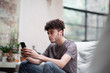 © ReeldealHD images - Young adult male on smartphone