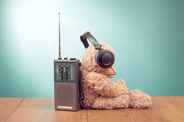 Wall Mural - Teddy Bear listen headphones, retro radio front mint green background