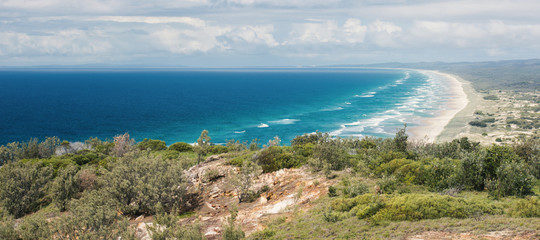 View of the pristine beach at Moreton Island during the day.