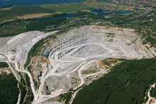 Limestone Quarry On The Background Of Urban Areas, Aerial Photography.