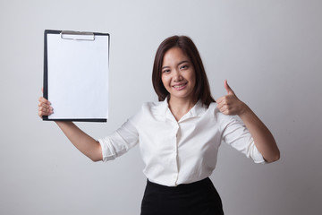 Asian business woman show thumbs up and blank clipboard.