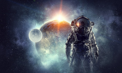 Wall Mural - astronaut in outer space. mixed media