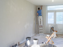 A Plasterer Working In A House