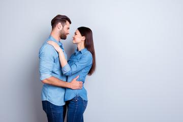 Wall Mural - Two happy people showing their love to each other by hugging and kissing